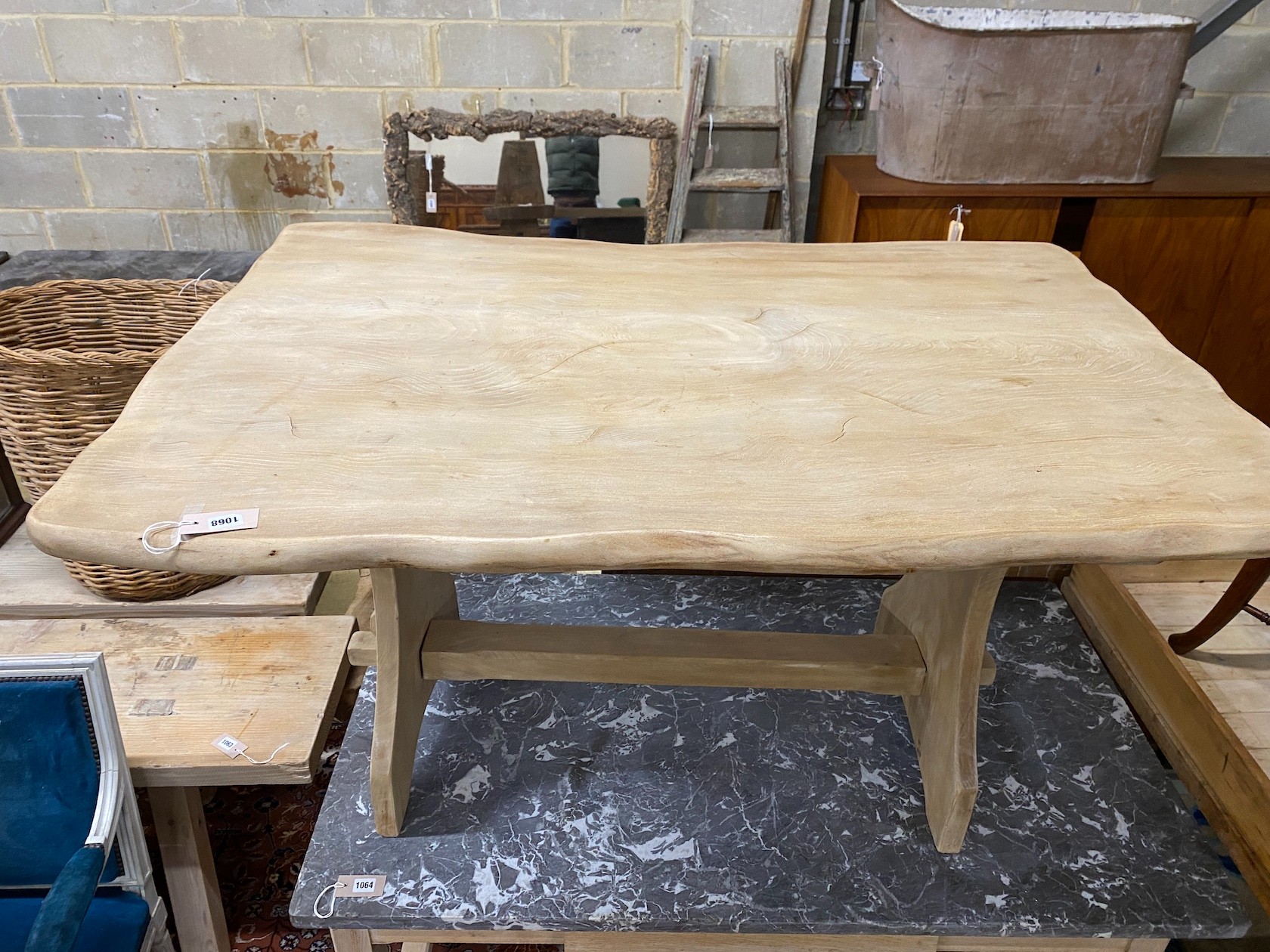 A Provincial bleached oak rectangular waney edge tavern type table, width 136cm, depth 92cm, height 75cm